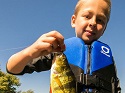 Pack snacks and bring minnows when you take a kid fishing