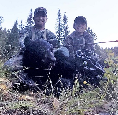 Charging Bruin From The Brush On A Elk Hunt